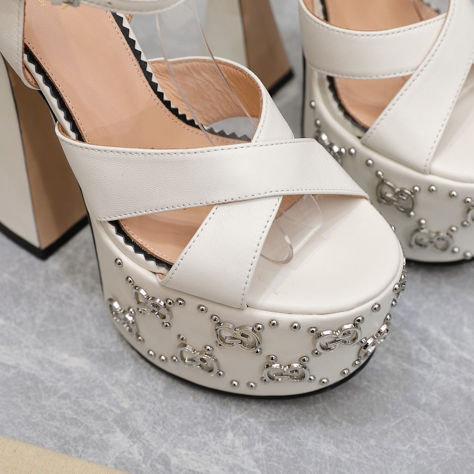 White interlocking studs sandal