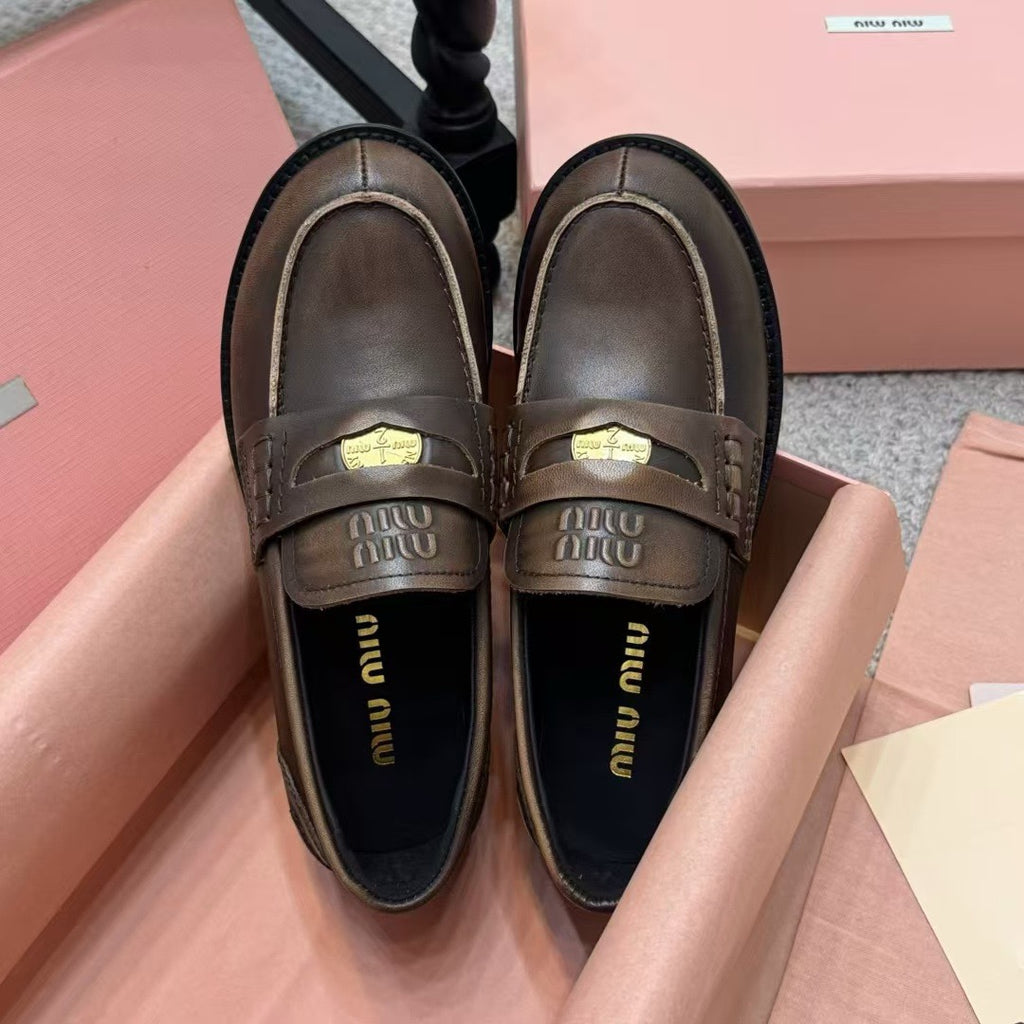 Ebony Vintage-Effect Leather Penny Loafers