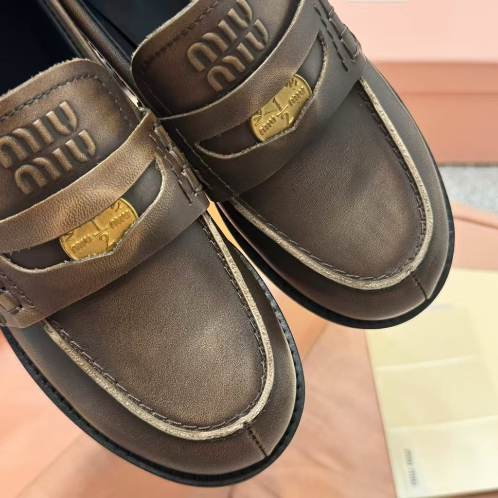 Ebony Vintage-Effect Leather Penny Loafers