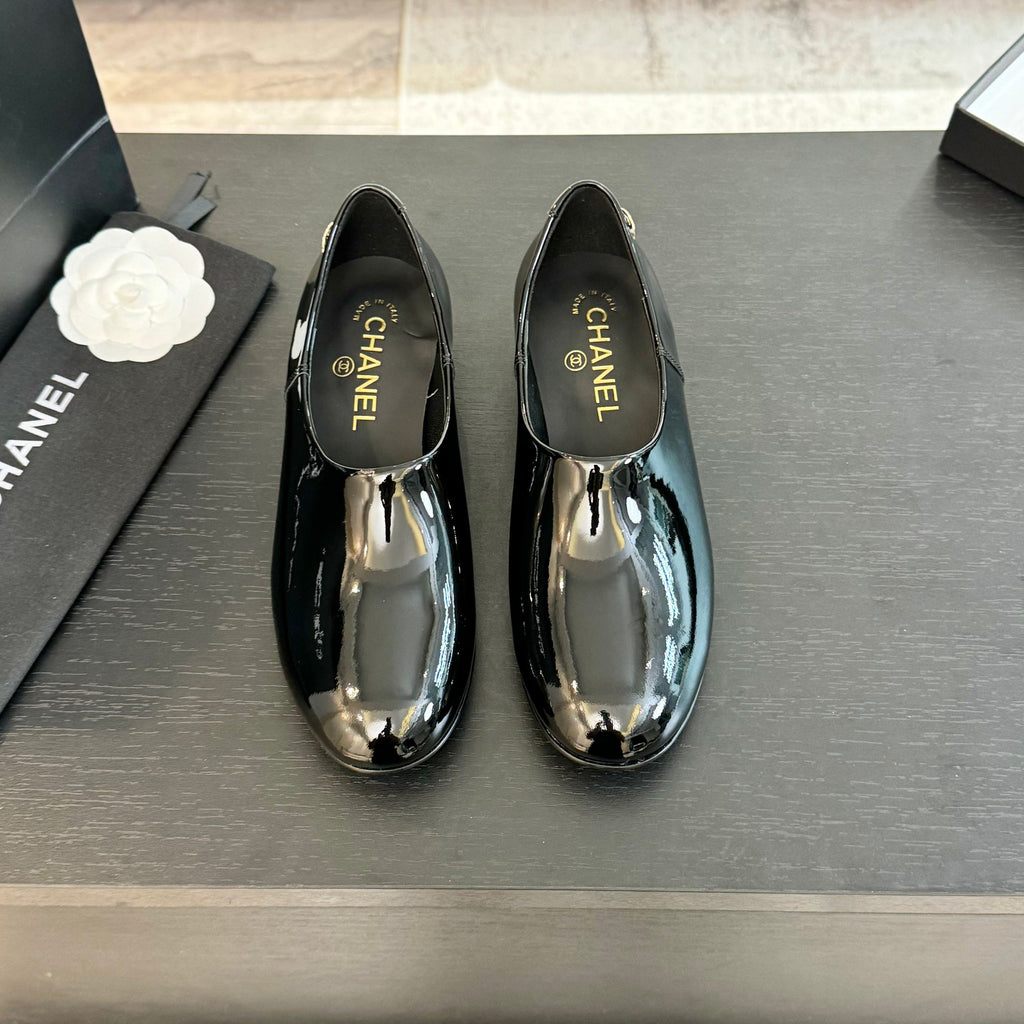 Black Moccasins In Patent Leather