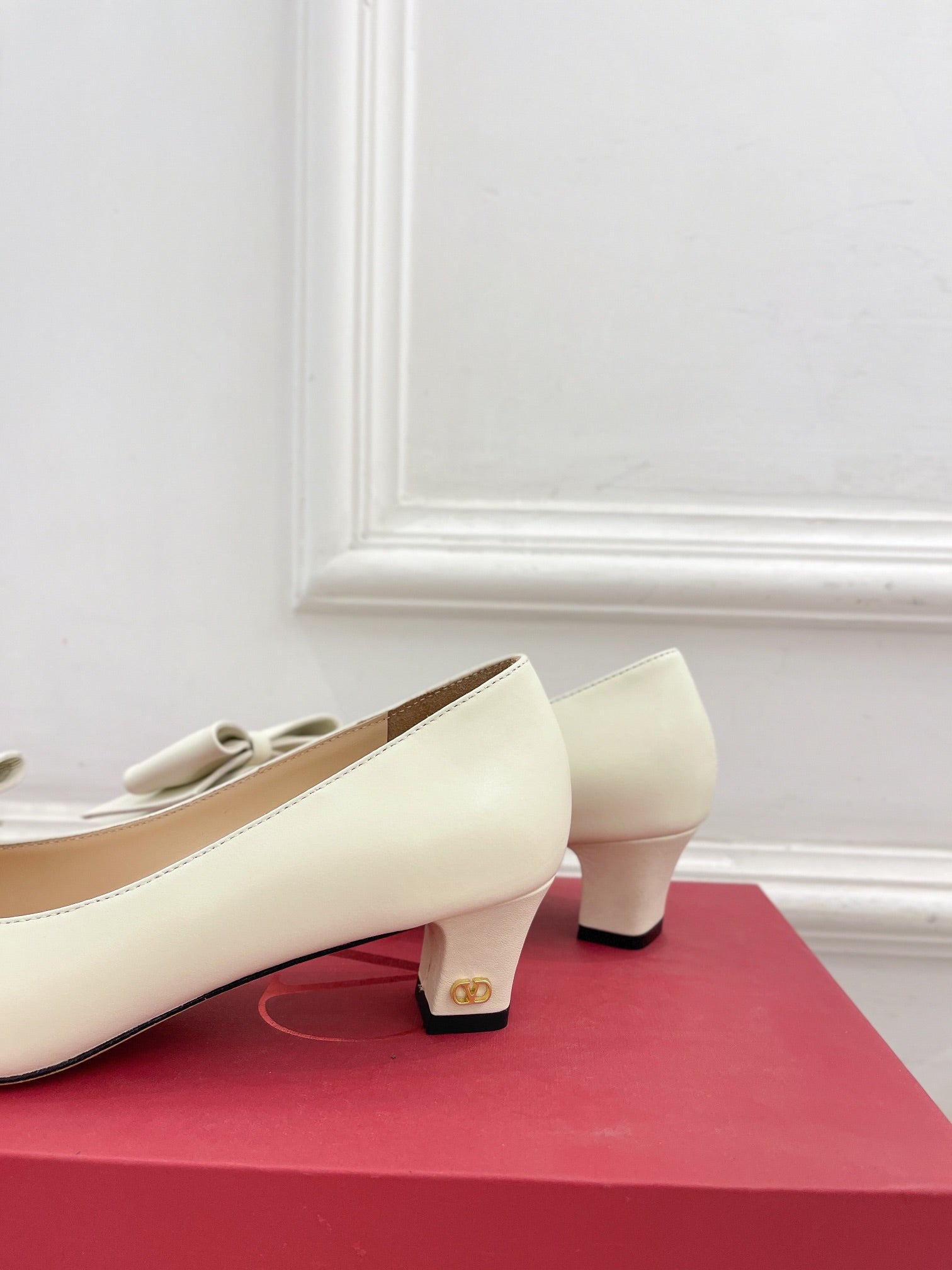 Ivory Bowow Pumps