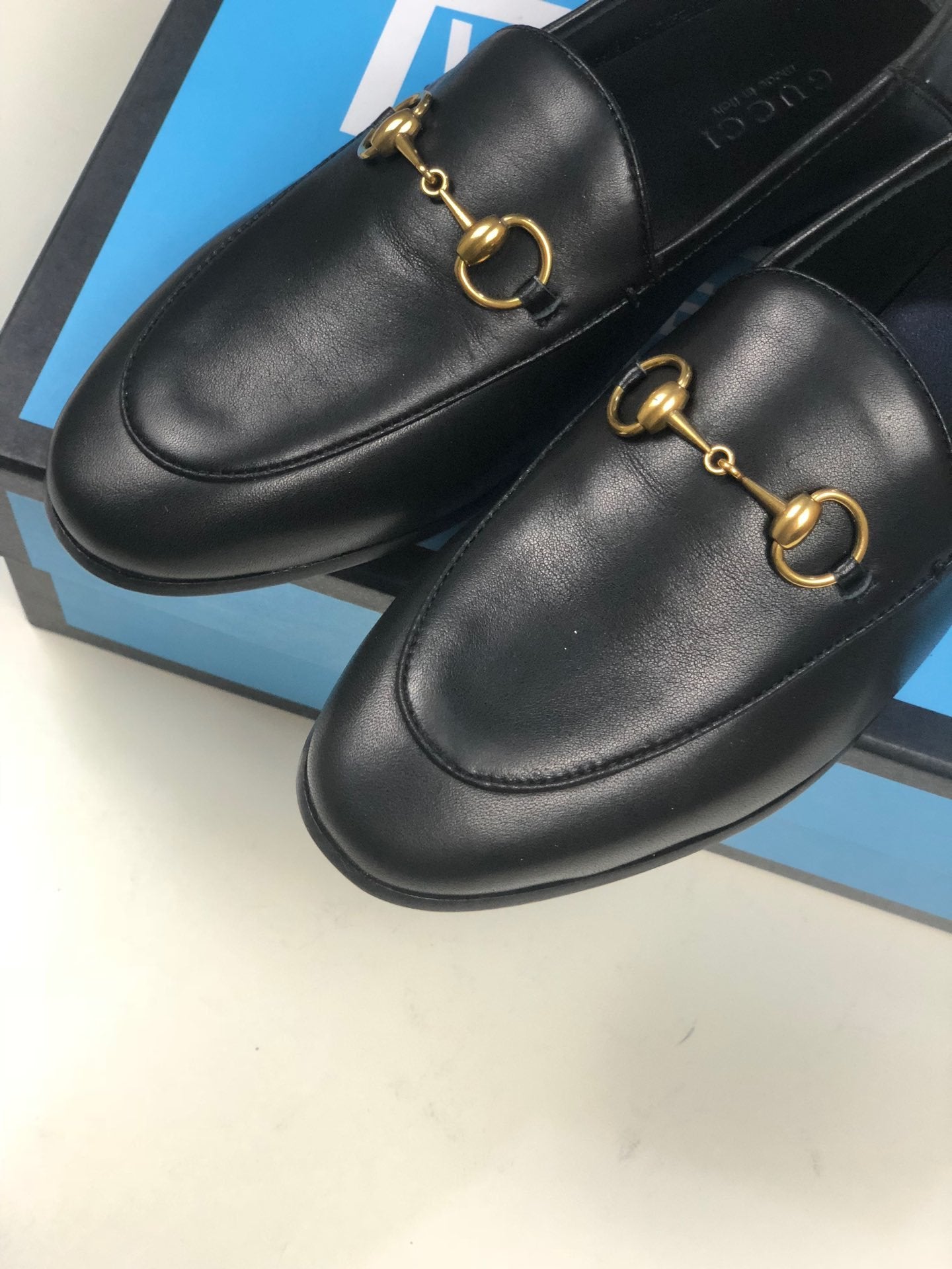 Black GB leather collapsible-heel loafers