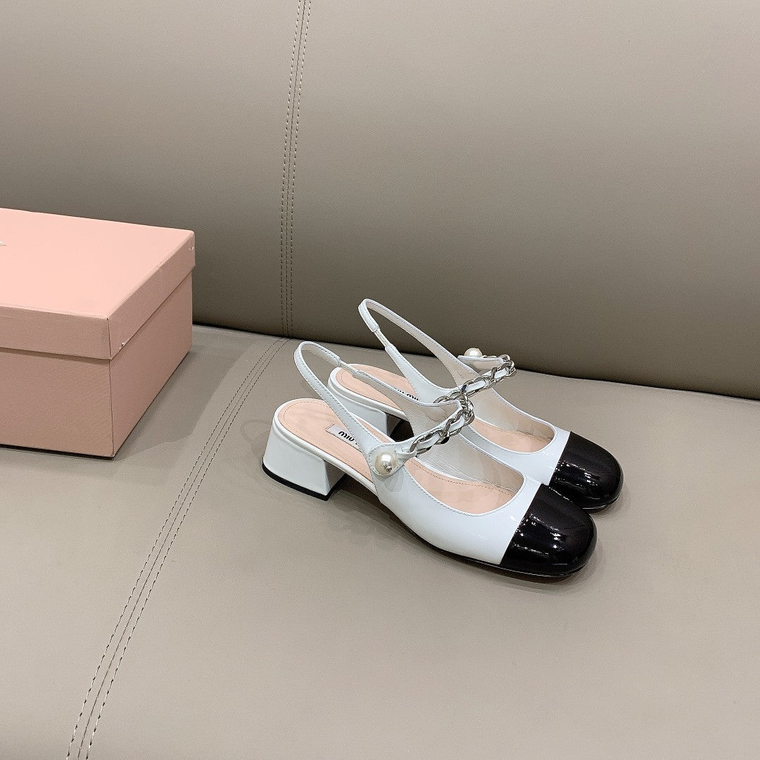 Black & white MM patent leather pumps