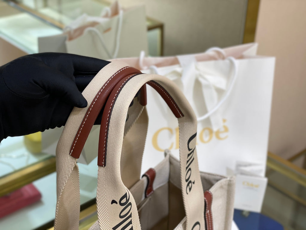 CW medium brown leather-trimmed cotton-canvas tote