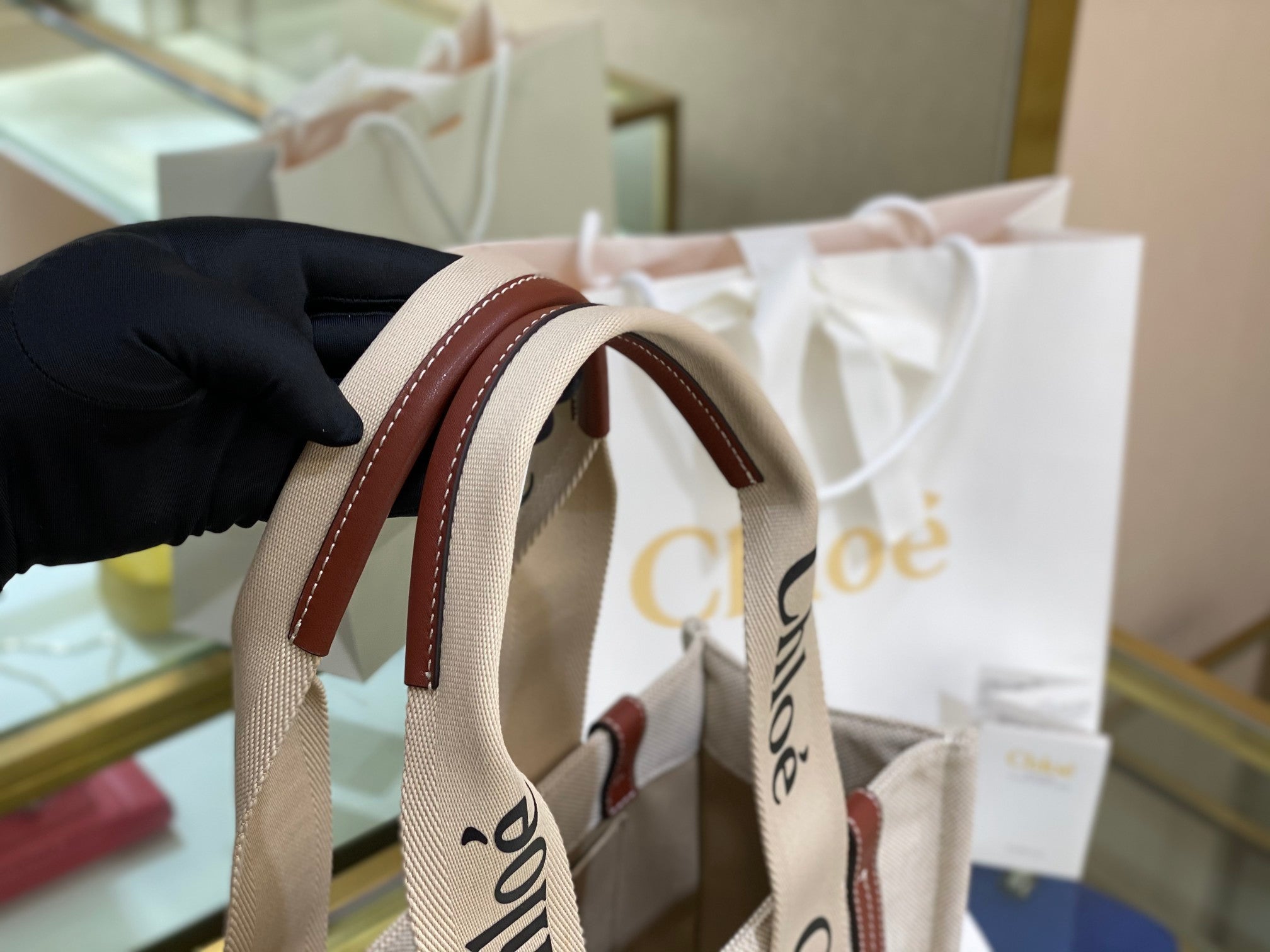 CW medium brown leather-trimmed cotton-canvas tote