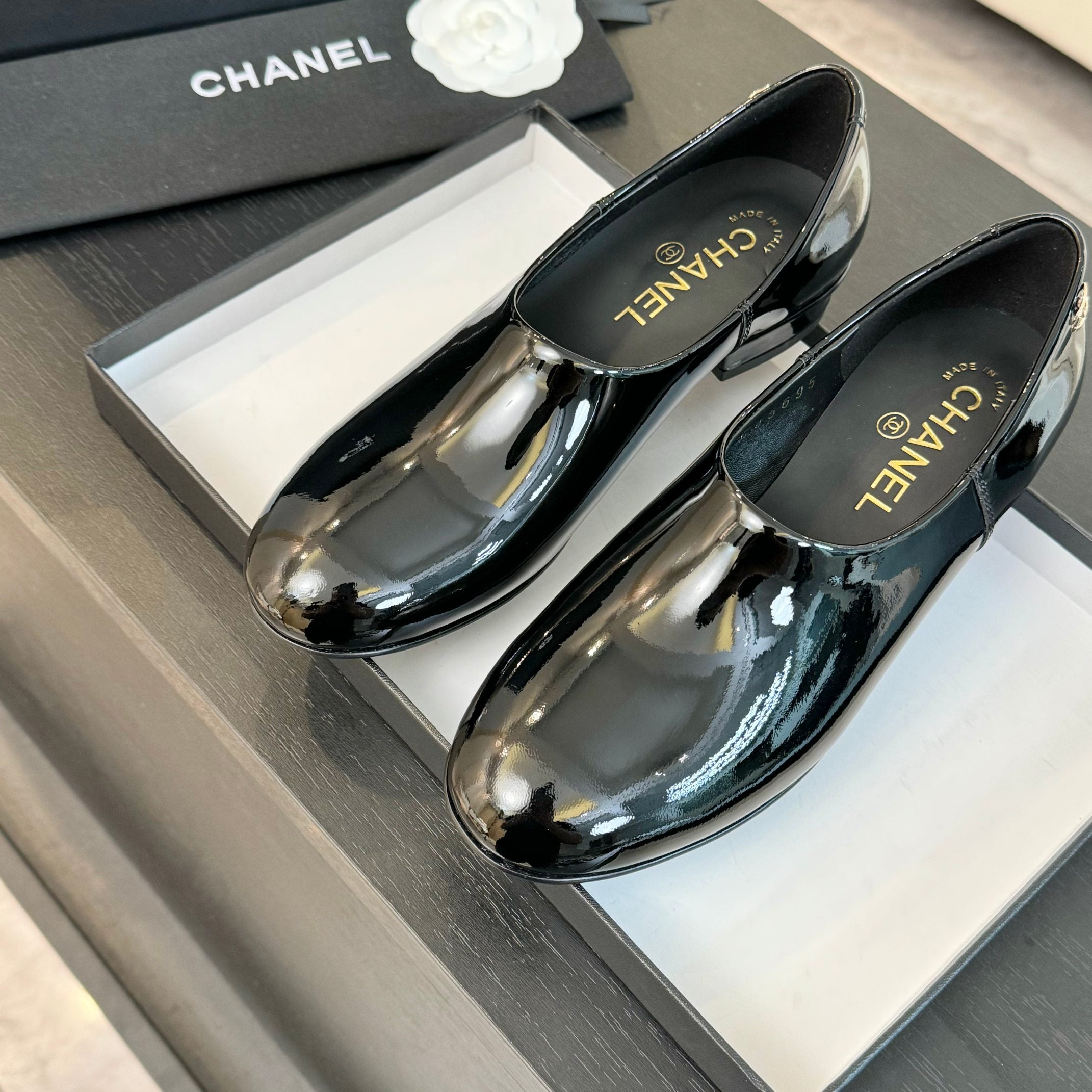 Black Moccasins In Patent Leather