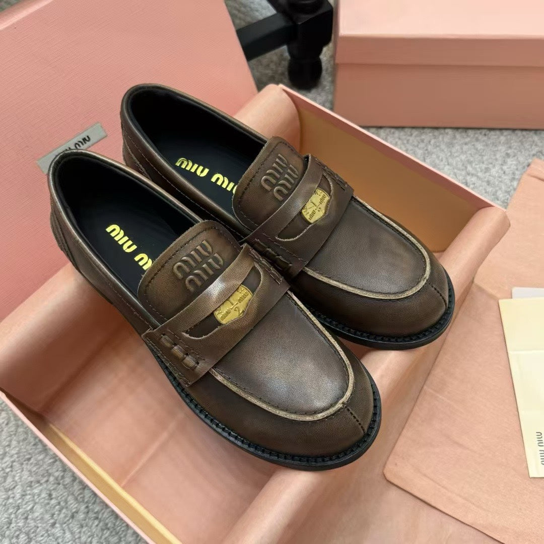 Ebony Vintage-Effect Leather Penny Loafers