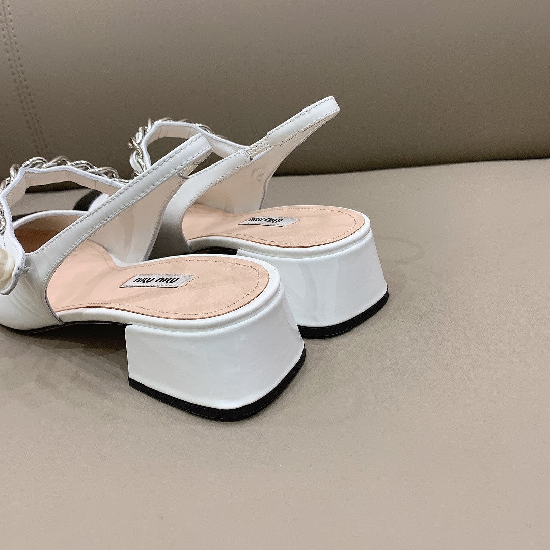 Black & white MM patent leather pumps