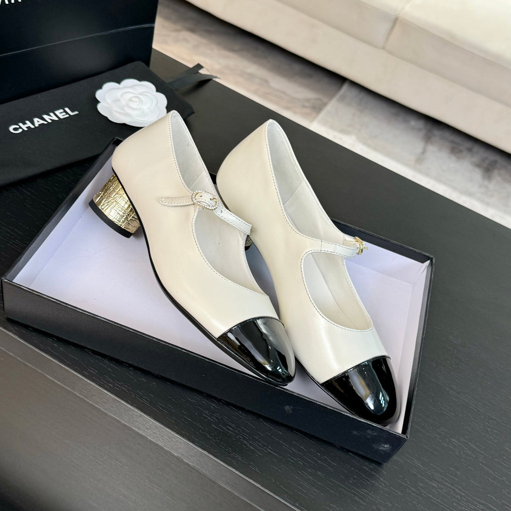 Ivory And Black MJ Pumps