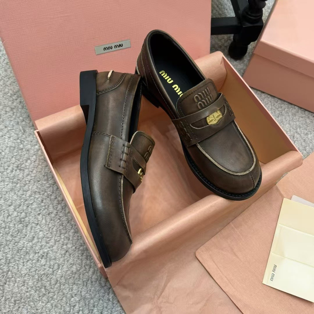 Ebony Vintage-Effect Leather Penny Loafers