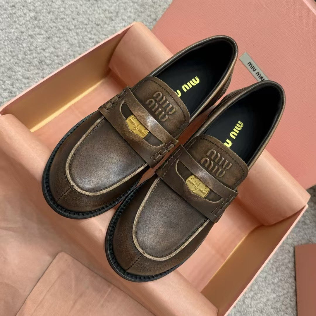 Ebony Vintage-Effect Leather Penny Loafers