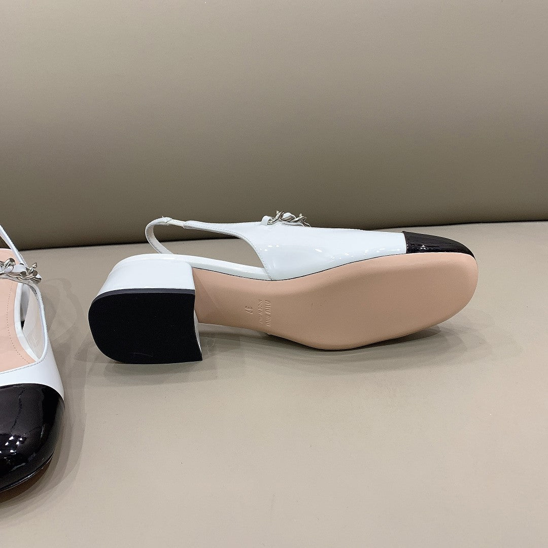 Black & white MM patent leather pumps