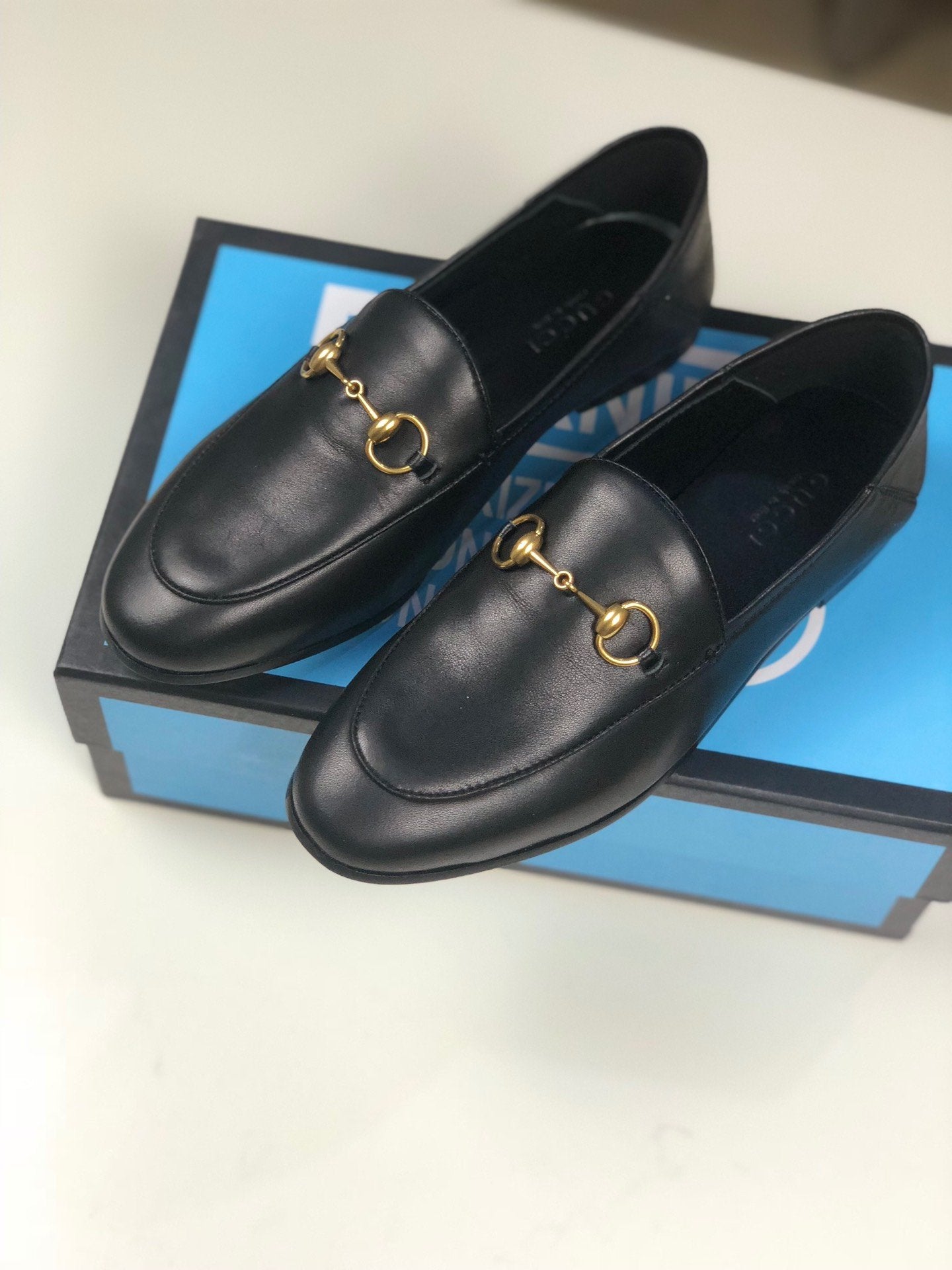 Black GB leather collapsible-heel loafers