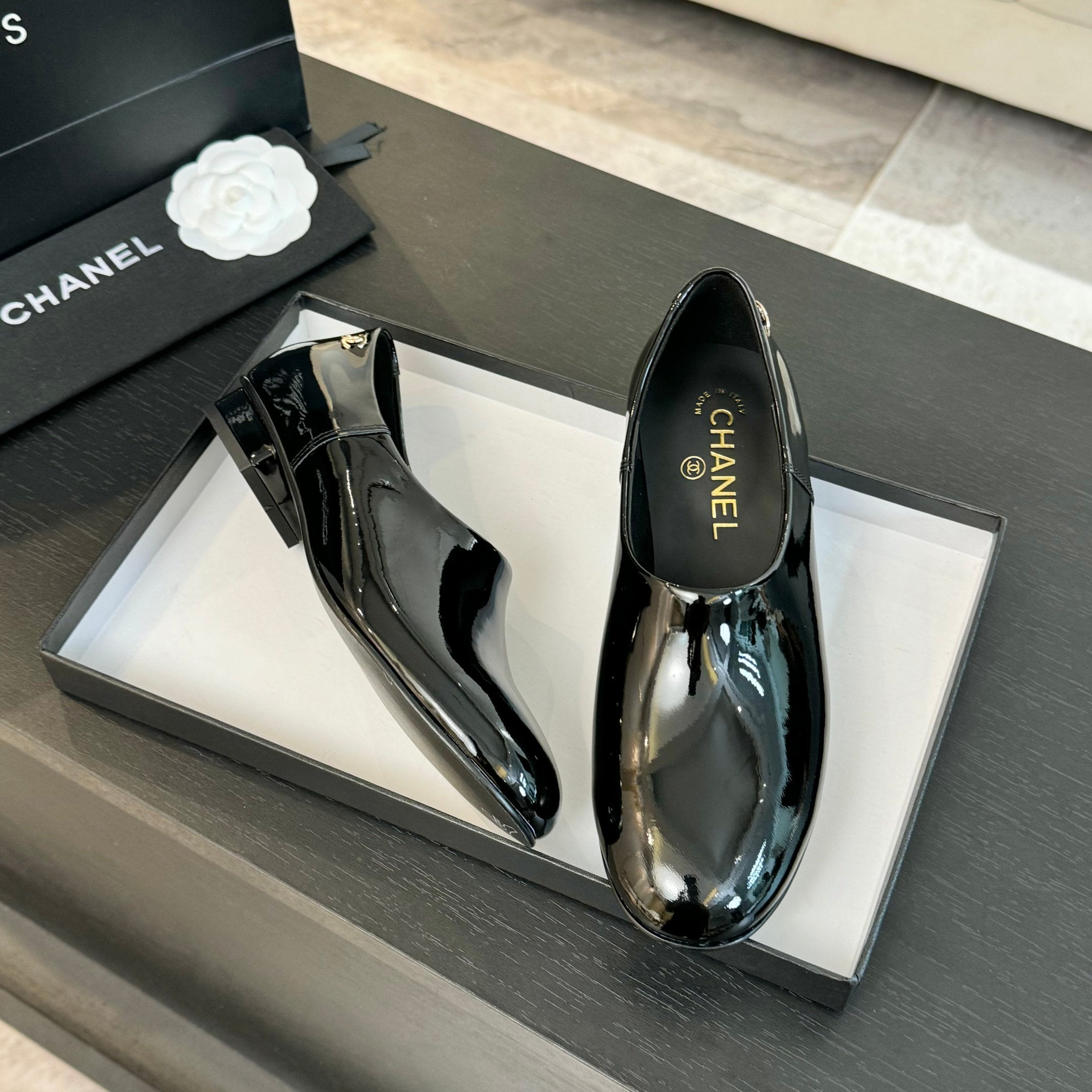 Black Moccasins In Patent Leather