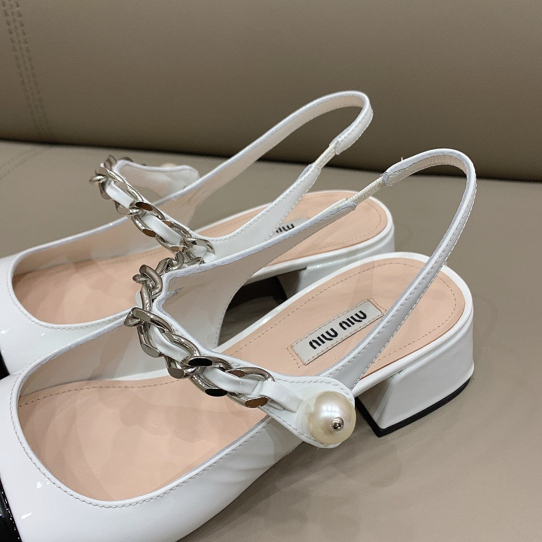 Black & white MM patent leather pumps