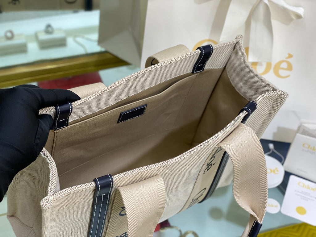 CW medium navy leather-trimmed cotton-canvas tote