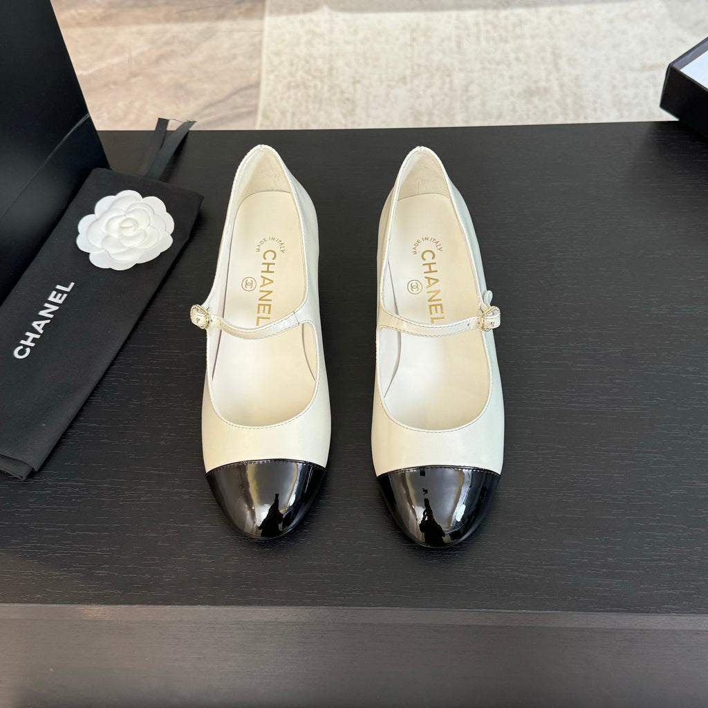Ivory And Black MJ Pumps
