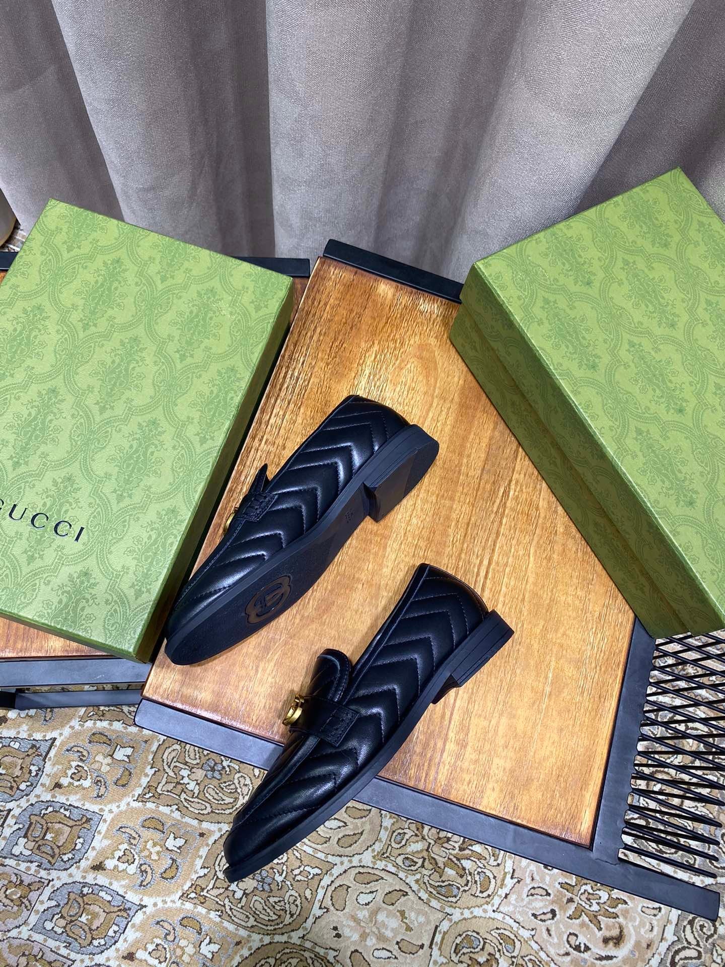 Black chevron matelassé loafers