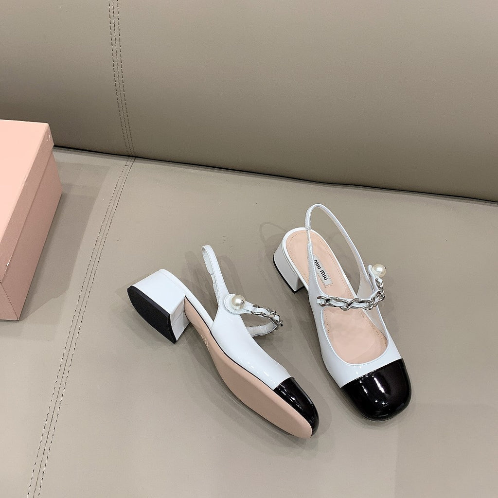 Black & white MM patent leather pumps