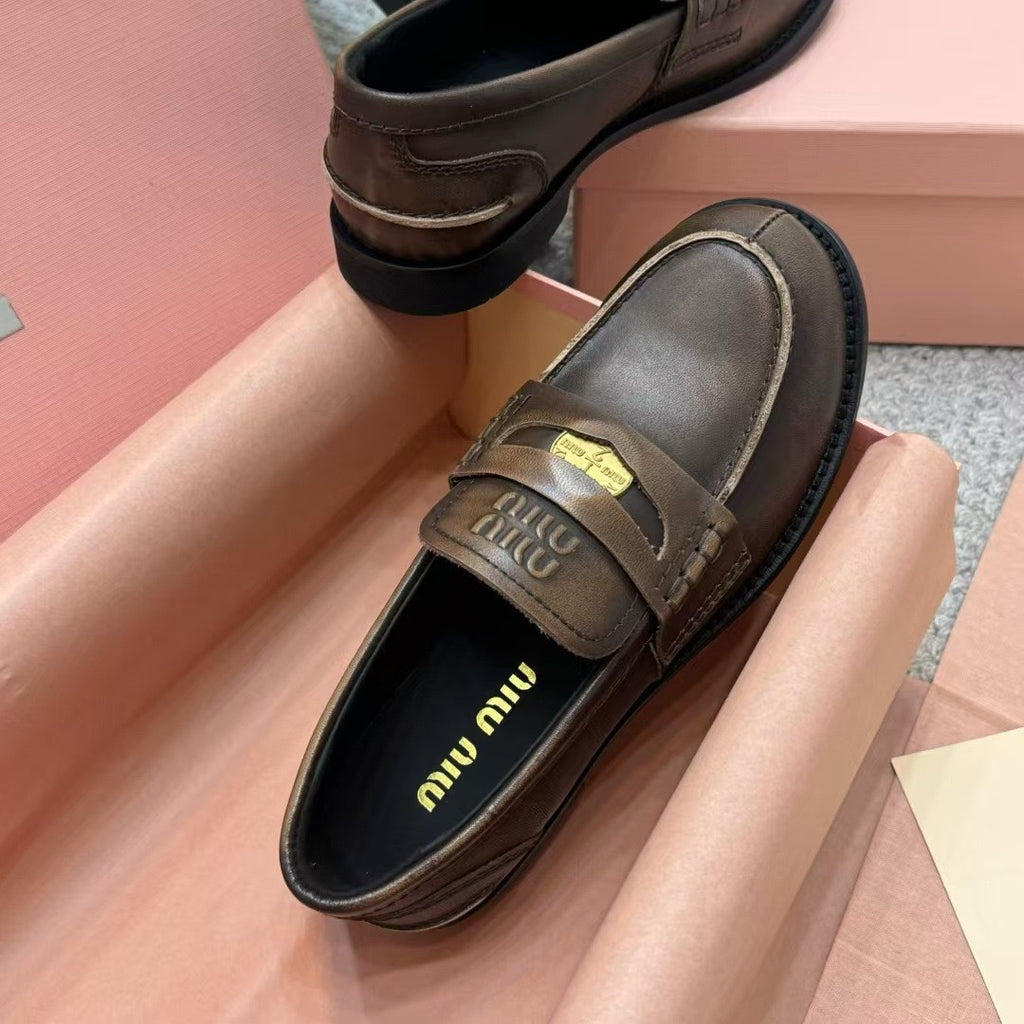 Ebony Vintage-Effect Leather Penny Loafers