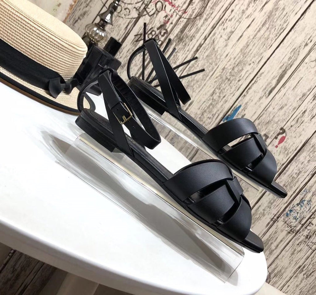 YT flat sandals in black leather