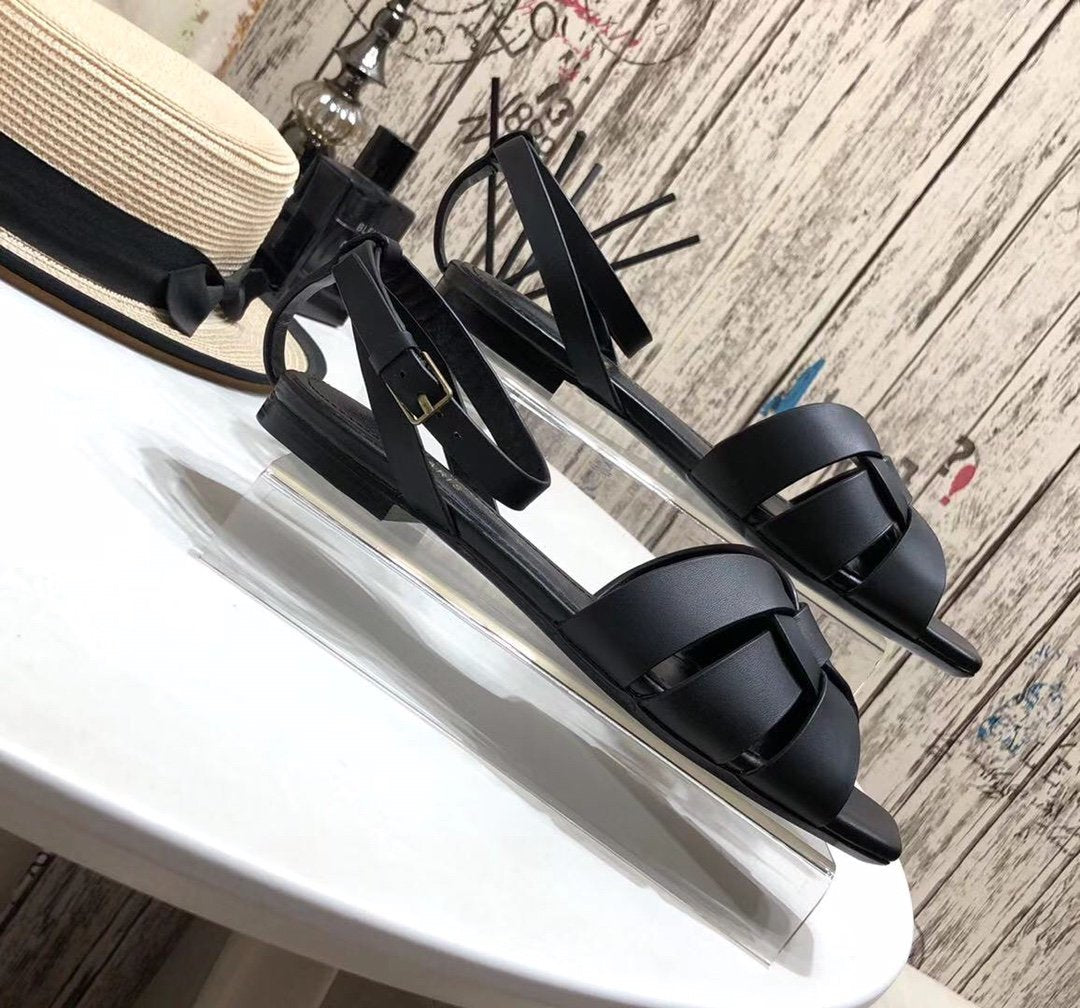 YT flat sandals in black leather