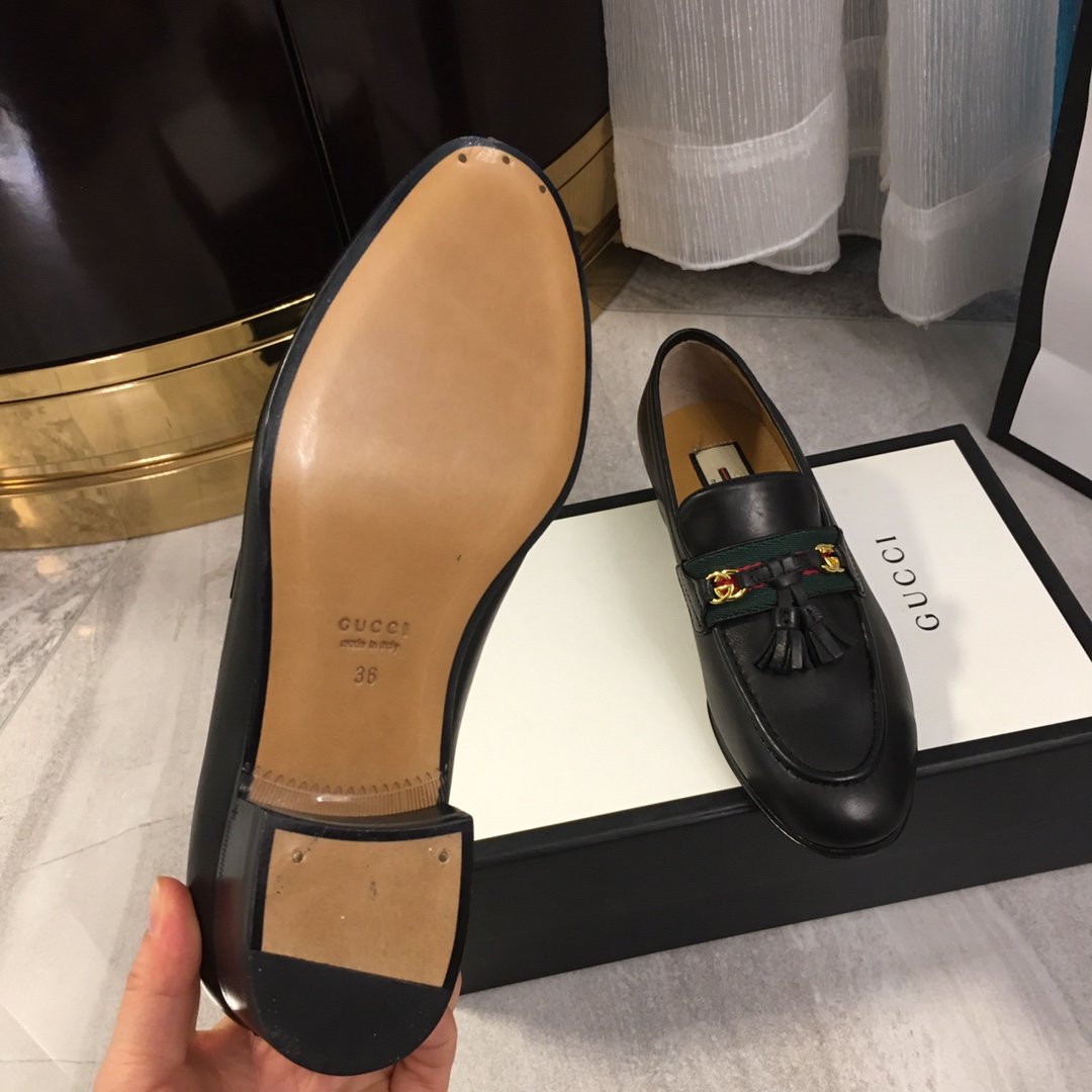 Black loafer with web