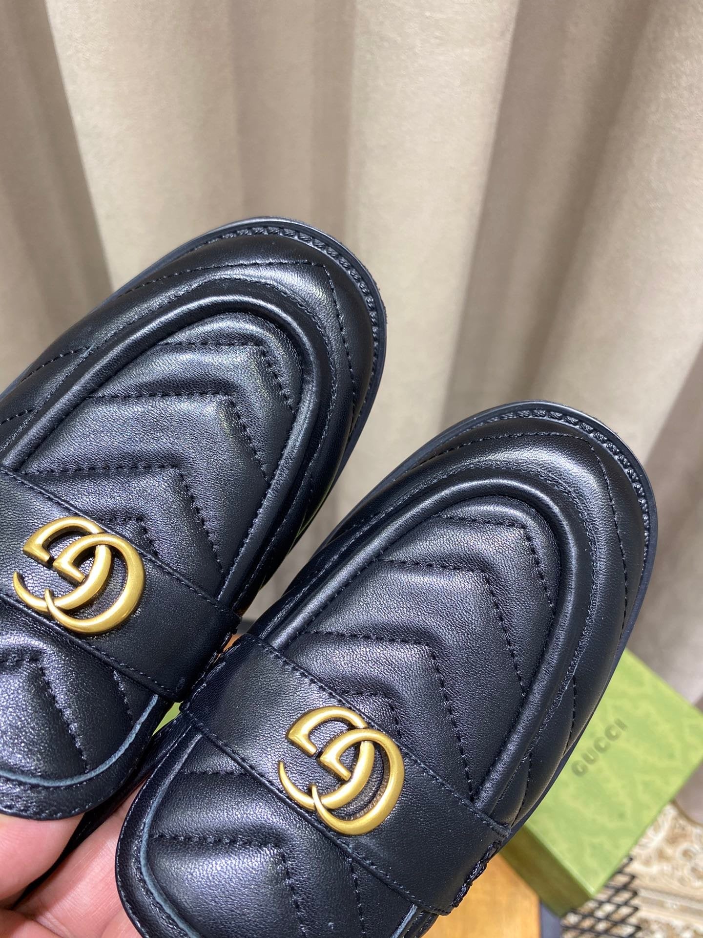 Black chevron matelassé loafers