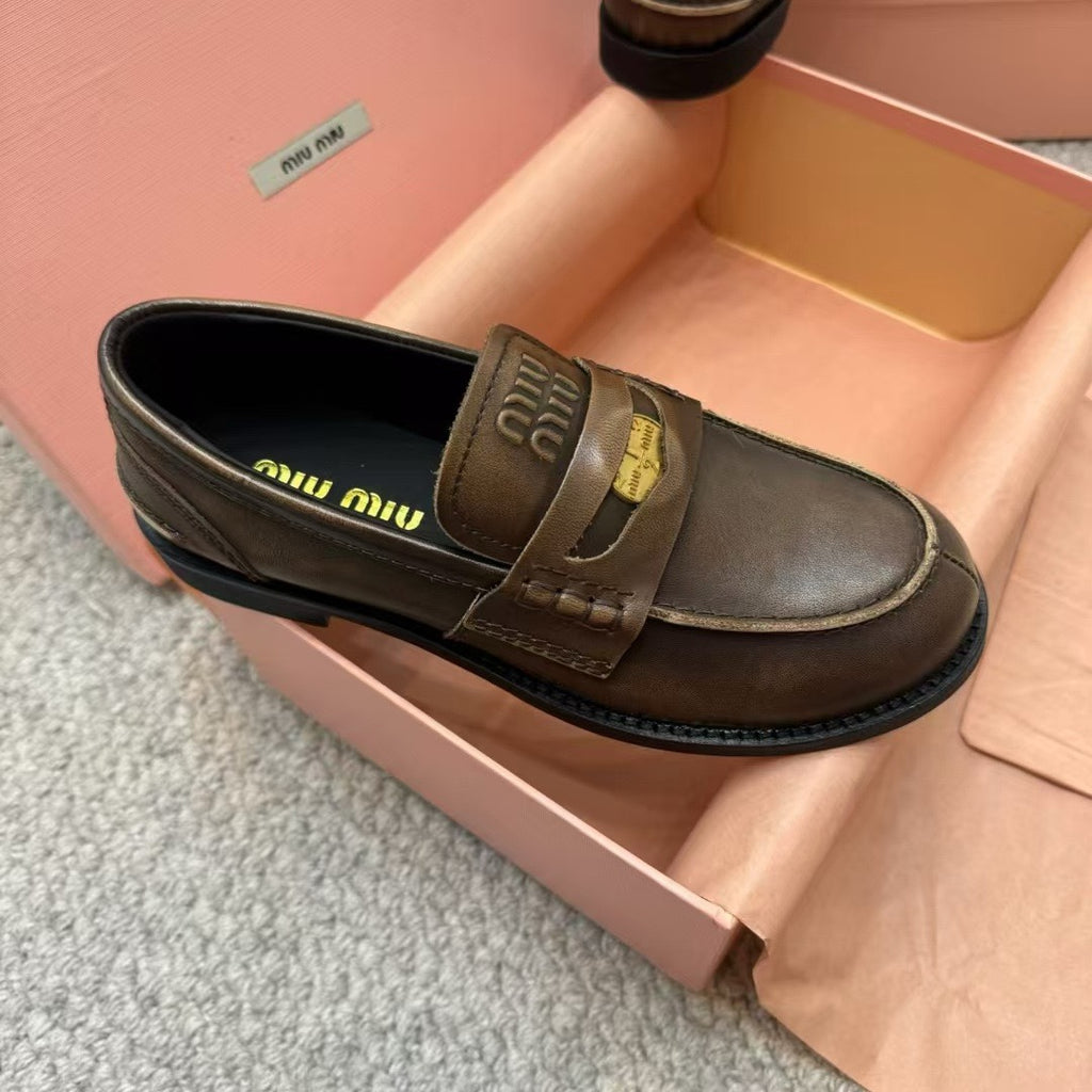 Ebony Vintage-Effect Leather Penny Loafers