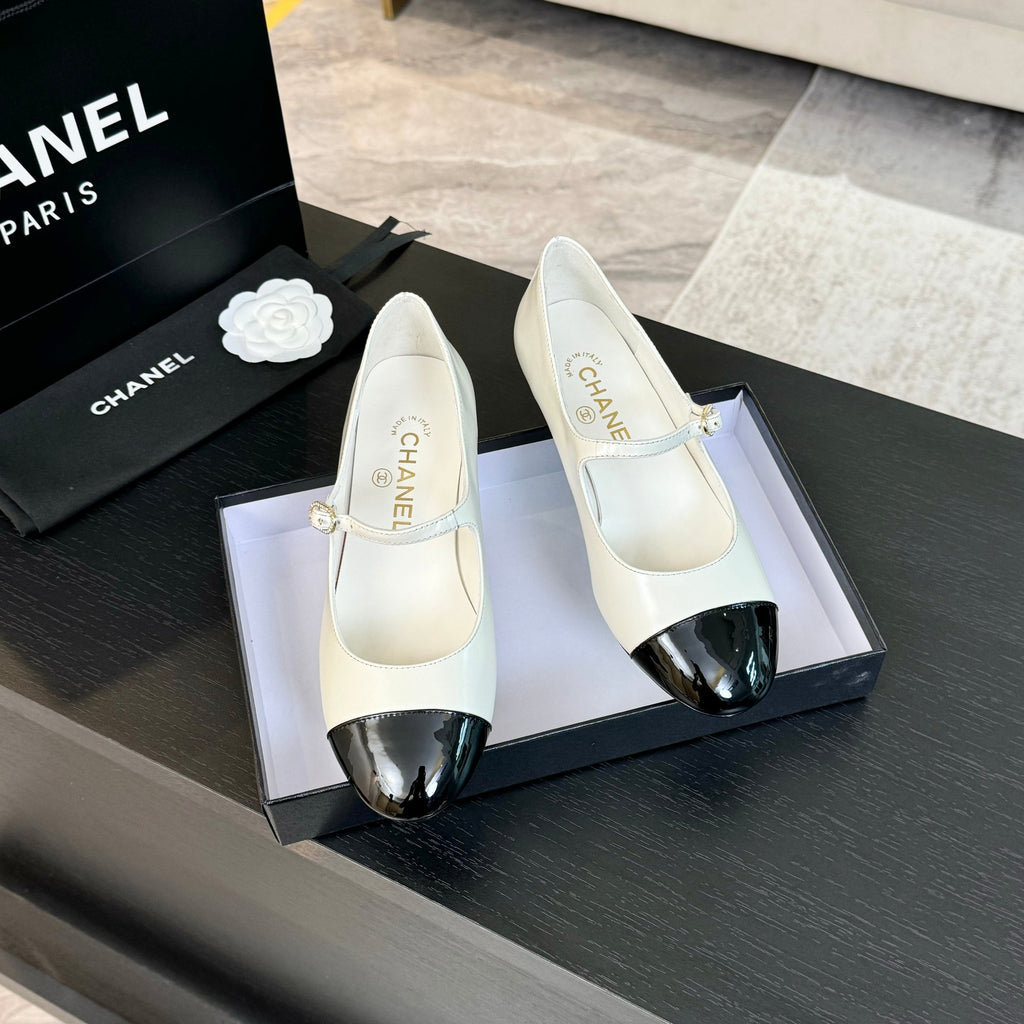 Ivory And Black MJ Pumps