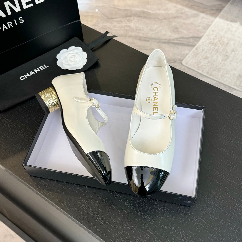 Ivory And Black MJ Pumps