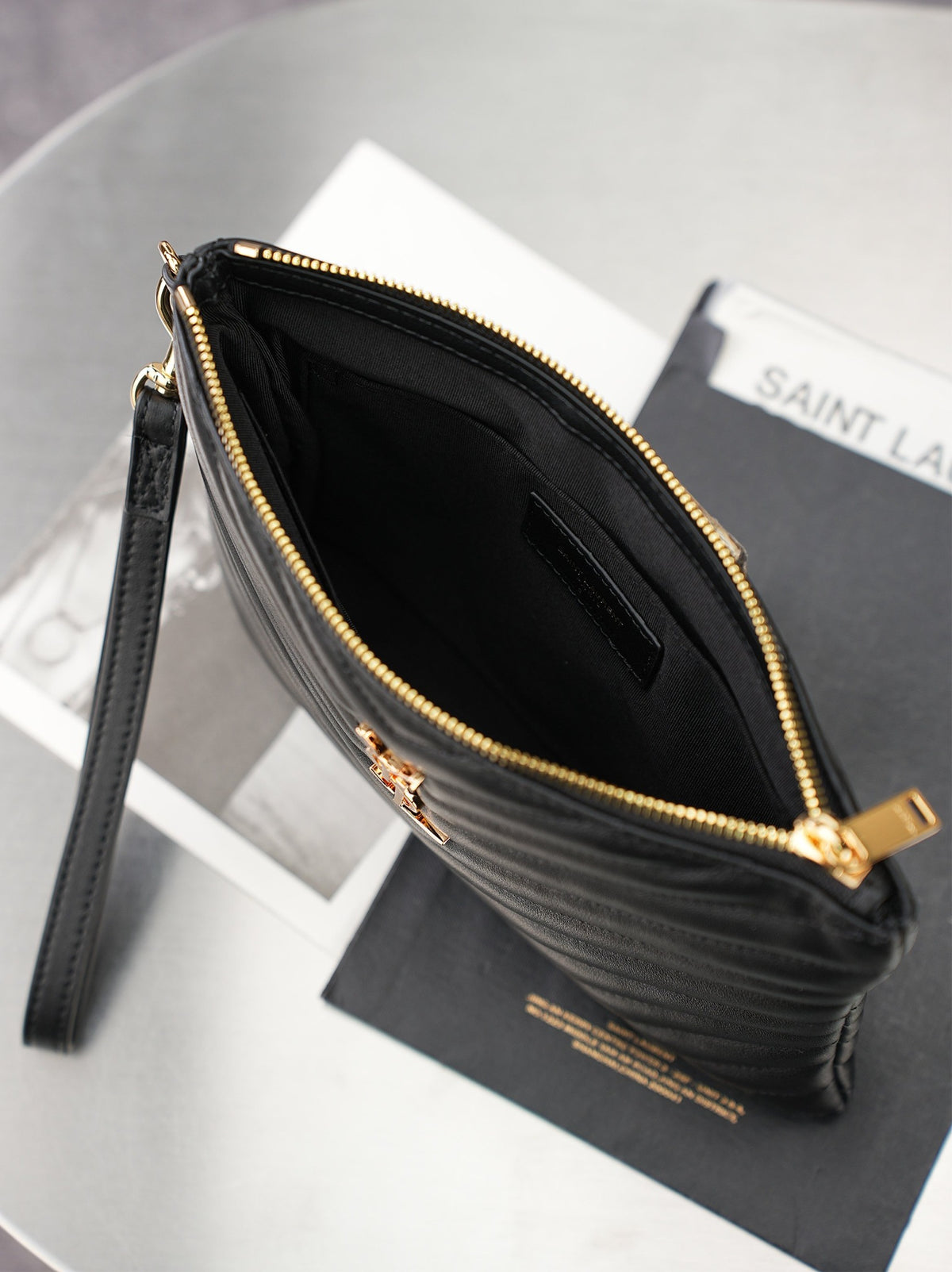 Black Cassandre Matelassé A5 Pouch In Leather