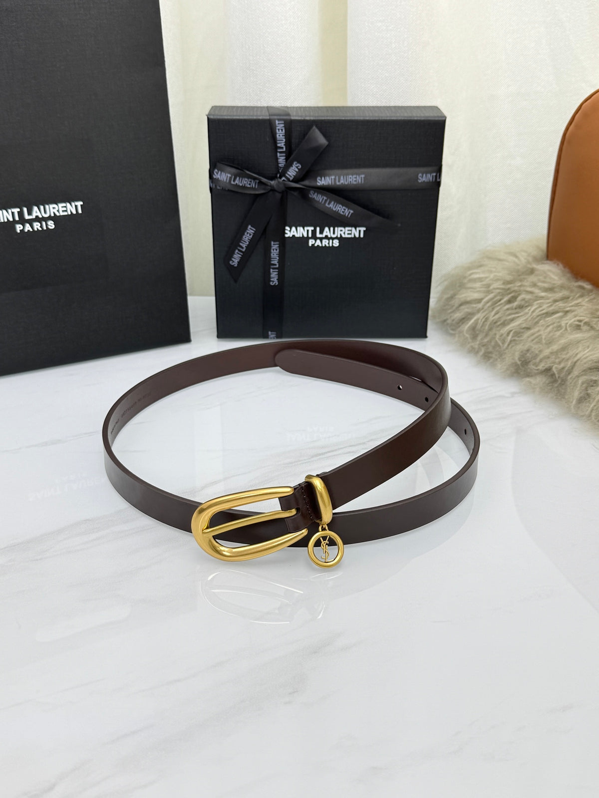 Burnt Chocolate Cassandre Charm Elongated Buckle Thin Belt In Leather