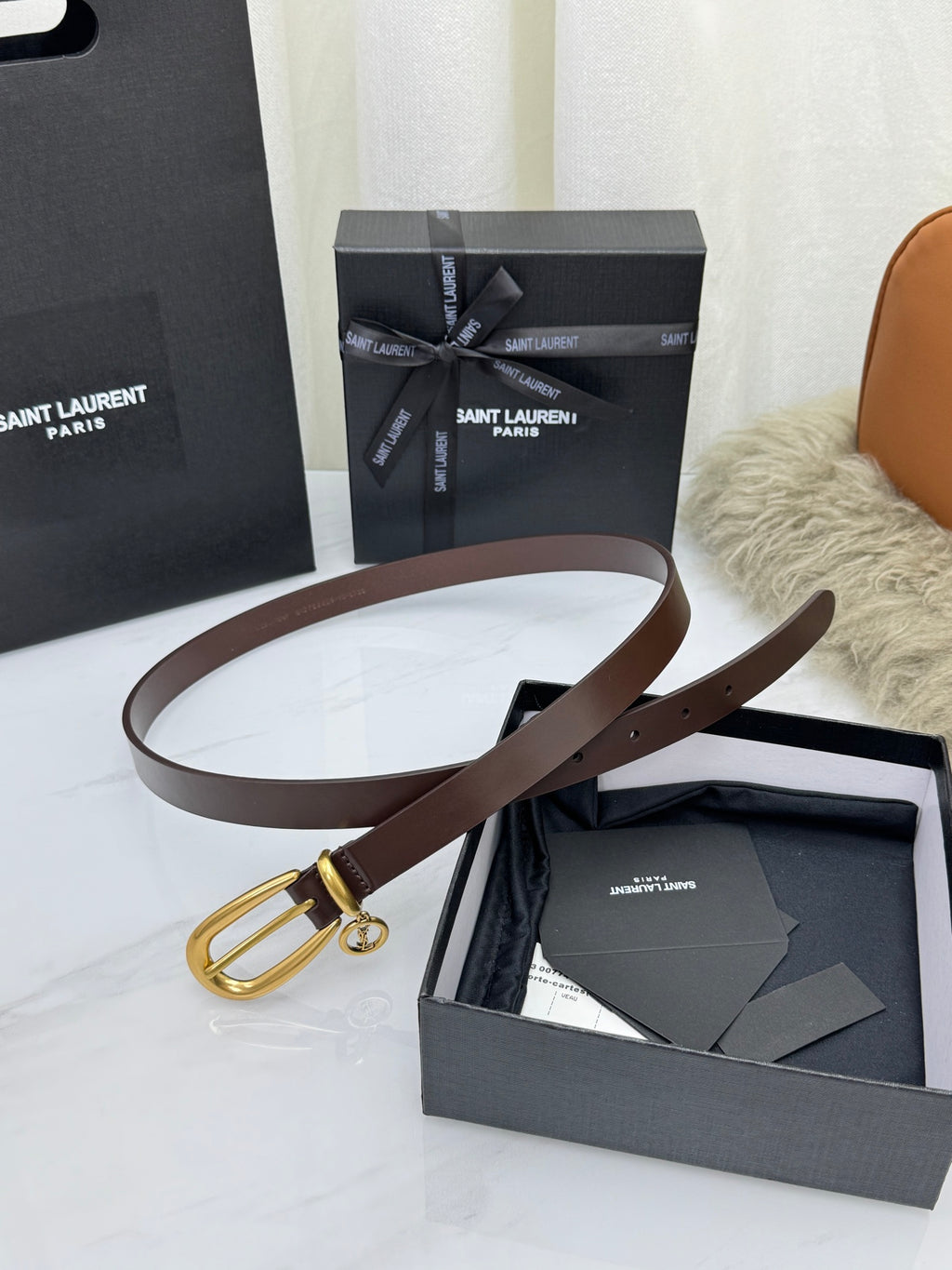 Burnt Chocolate Cassandre Charm Elongated Buckle Thin Belt In Leather